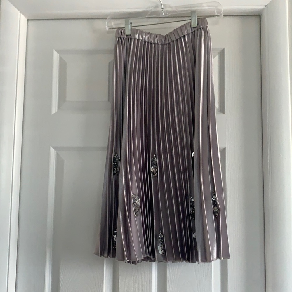 Brand- Valiant, size small, color- metallic platinum